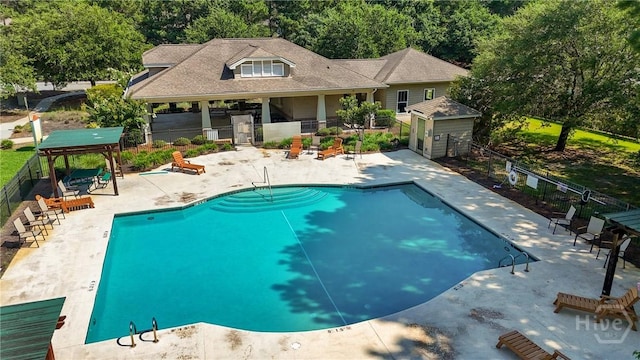 302 Morgan Pines Dr, Pooler, GA 31322 - community pool with a patio area and an outbuilding