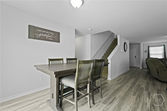 13 Summer Place Dr, Guyton, GA 31312 - dining area featuring wood finished floors and stairway