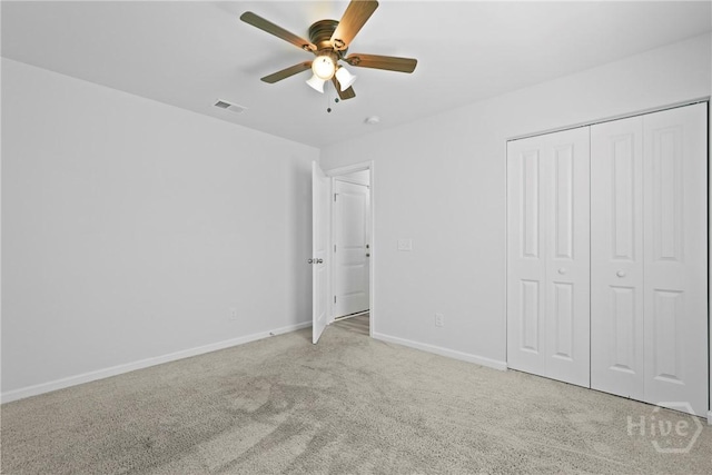13 Summer Place Dr, Guyton, GA 31312 - unfurnished bedroom with light carpet, a closet, and a ceiling fan