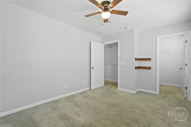 13 Summer Place Dr, Guyton, GA 31312 - unfurnished bedroom with a walk in closet, carpet flooring, and ceiling fan