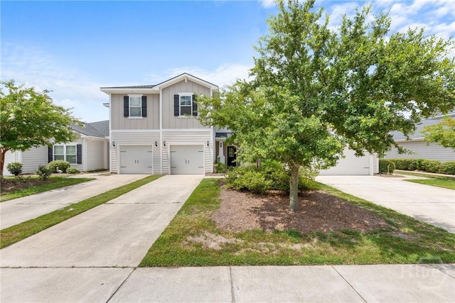 160 Lake Lily Dr, Richmond Hill, GA 31324 - view of front of home featuring board and batten siding, concrete driveway, and an attached garage