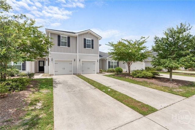 160 Lake Lily Dr, Richmond Hill, GA 31324 - view of front of property featuring board and batten siding, concrete driveway, and an attached garage