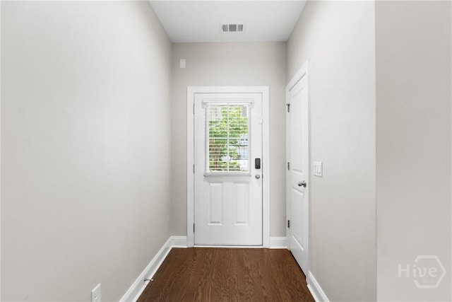 160 Lake Lily Dr, Richmond Hill, GA 31324 - doorway to outside featuring dark wood-type flooring and baseboards
