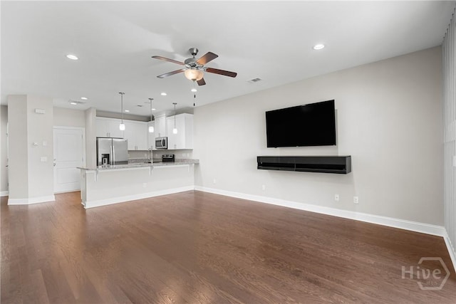 160 Lake Lily Dr, Richmond Hill, GA 31324 - unfurnished living room with ceiling fan, dark wood-type flooring, and recessed lighting