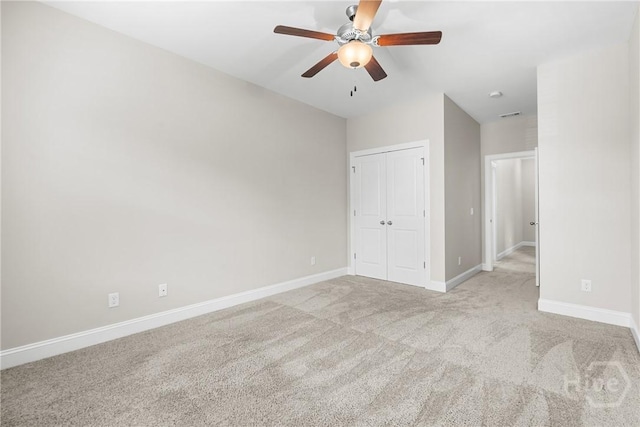 160 Lake Lily Dr, Richmond Hill, GA 31324 - unfurnished bedroom featuring carpet flooring, a closet, lofted ceiling, and a ceiling fan