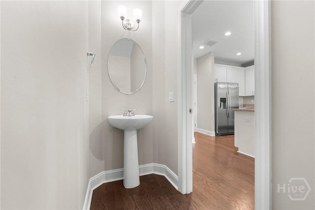 160 Lake Lily Dr, Richmond Hill, GA 31324 - bathroom with wood finished floors and recessed lighting
