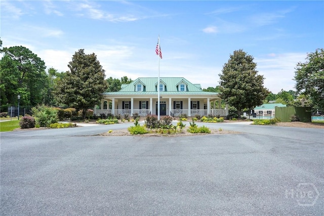 137 Regency Cir, Pooler, GA 31322 - farmhouse inspired home featuring a porch, a standing seam roof, and a metal roof