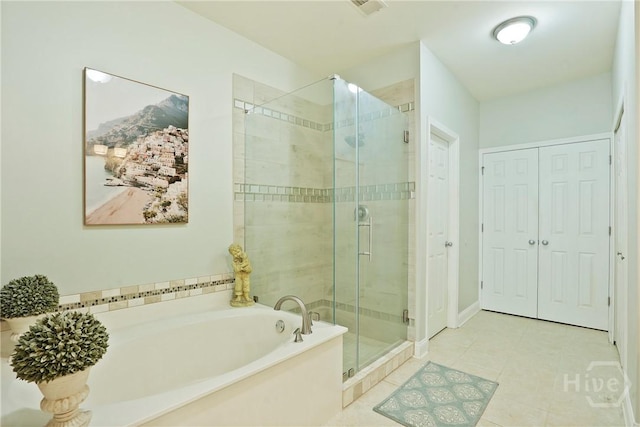 137 Regency Cir, Pooler, GA 31322 - bathroom featuring a garden tub, a stall shower, tile patterned flooring, and a closet