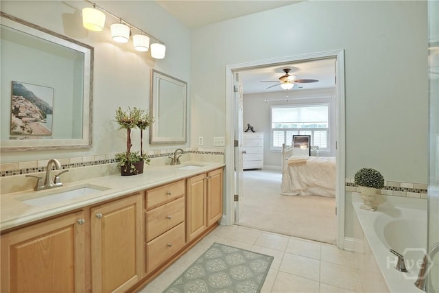 137 Regency Cir, Pooler, GA 31322 - ensuite bathroom with tile patterned flooring, double vanity, a ceiling fan, and a tub to relax in