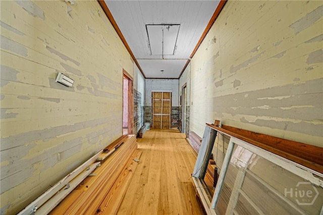 438 Kessler Loop, Guyton, GA 31312 - corridor featuring attic access, light wood-style flooring, and wooden walls