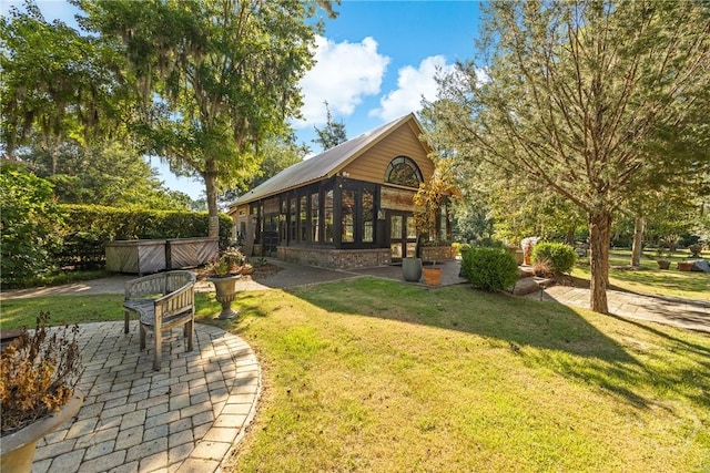 438 Kessler Loop, Guyton, GA 31312 - view of grassy yard featuring a patio area and a jacuzzi