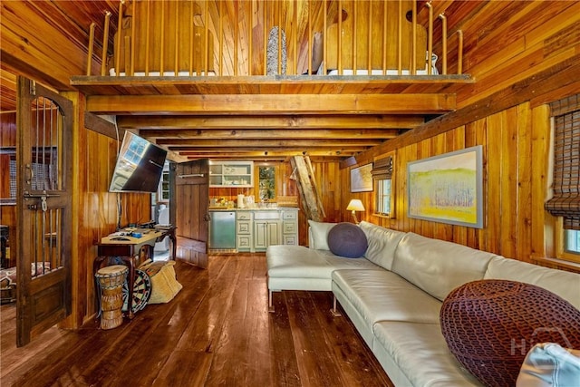 438 Kessler Loop, Guyton, GA 31312 - living room featuring wooden walls, dark wood-style floors, and beamed ceiling