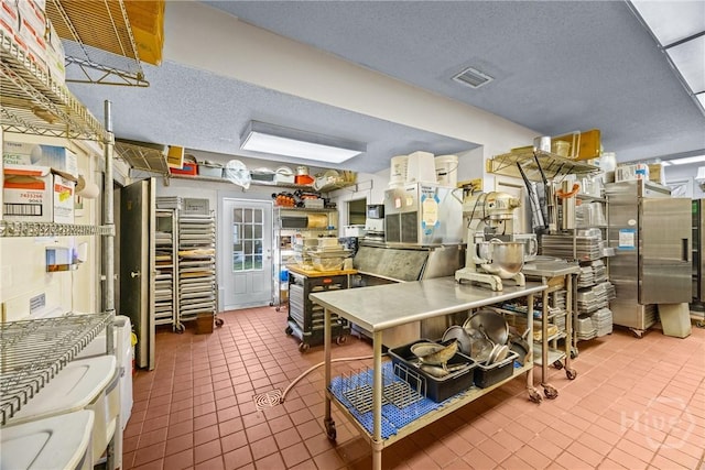 438 Kessler Loop, Guyton, GA 31312 - kitchen with tile patterned floors and a textured ceiling