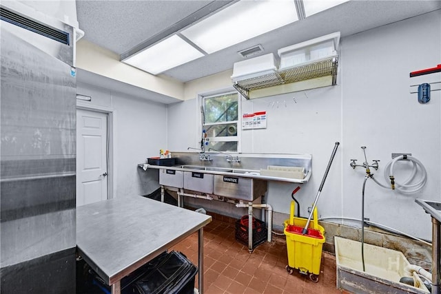 438 Kessler Loop, Guyton, GA 31312 - kitchen featuring stainless steel refrigerator and tile patterned floors