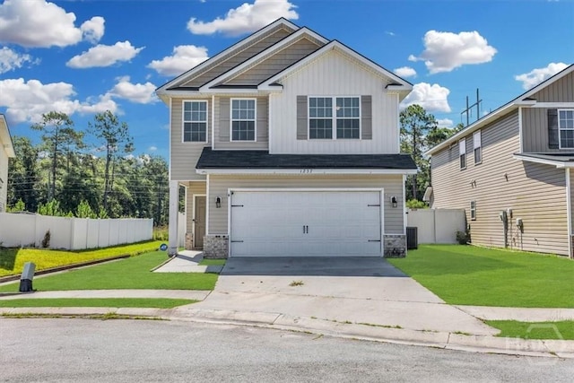 1237 Cypress Fall Cir, Hinesville, GA 31313 - view of front of property featuring a garage, driveway, stone siding, and board and batten siding