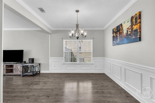 1237 Cypress Fall Cir, Hinesville, GA 31313 - dining room with a chandelier, dark wood-type flooring, wainscoting, and ornamental molding