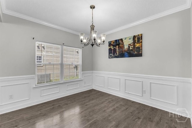 1237 Cypress Fall Cir, Hinesville, GA 31313 - unfurnished dining area featuring a chandelier, ornamental molding, wainscoting, and dark wood finished floors