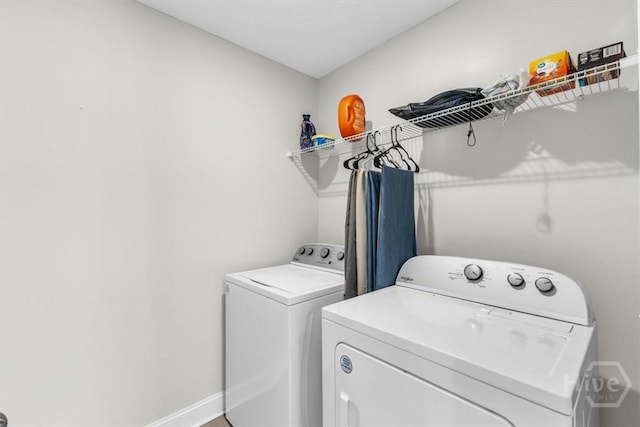 1237 Cypress Fall Cir, Hinesville, GA 31313 - washroom featuring washing machine and clothes dryer and baseboards
