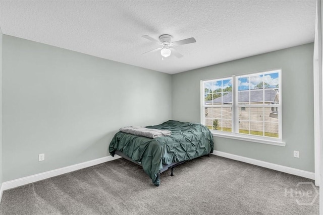 1237 Cypress Fall Cir, Hinesville, GA 31313 - carpeted bedroom featuring a textured ceiling and a ceiling fan