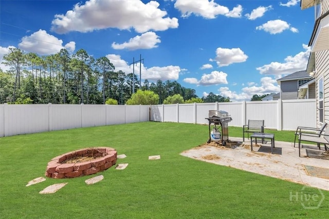 1237 Cypress Fall Cir, Hinesville, GA 31313 - fenced backyard with a fire pit