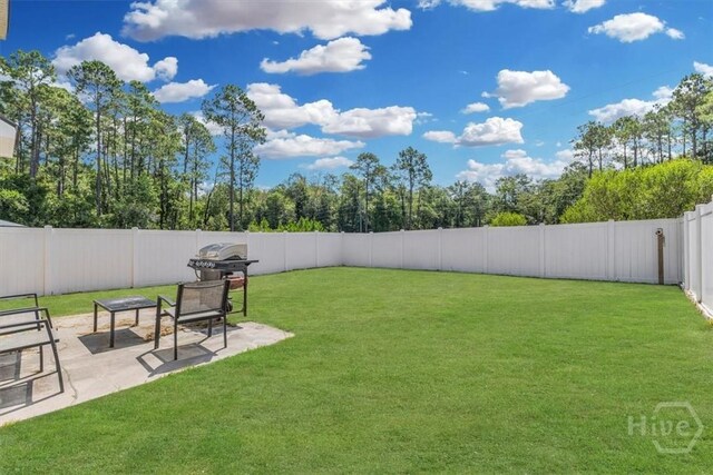 1237 Cypress Fall Cir, Hinesville, GA 31313 - fenced backyard with a patio area