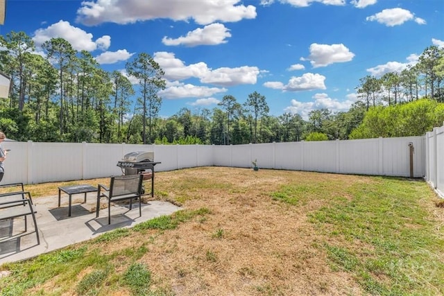 1237 Cypress Fall Cir, Hinesville, GA 31313 - fenced backyard with a patio