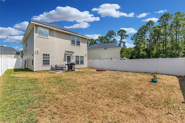 1237 Cypress Fall Cir, Hinesville, GA 31313 - back of property with a fenced backyard and a patio area