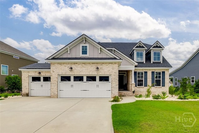 127 Champlain Dr, Pooler, GA 31322 - craftsman-style house with brick siding, driveway, and a garage