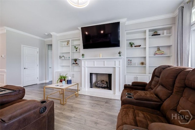 127 Champlain Dr, Pooler, GA 31322 - living room featuring built in features, wood finished floors, a fireplace with raised hearth, and ornamental molding