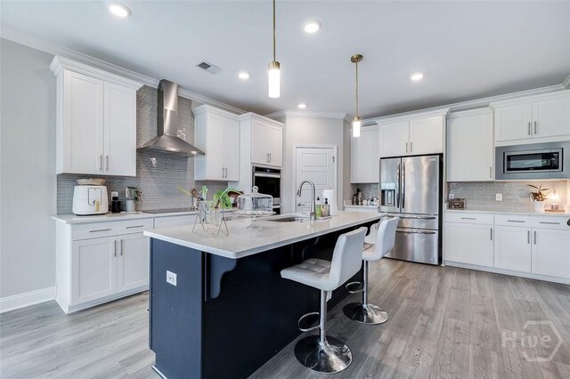 127 Champlain Dr, Pooler, GA 31322 - kitchen featuring appliances with stainless steel finishes, wall chimney exhaust hood, tasteful backsplash, white cabinets, and ornamental molding