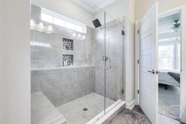 127 Champlain Dr, Pooler, GA 31322 - ensuite bathroom with crown molding, a shower stall, plenty of natural light, a ceiling fan, and wood finished floors