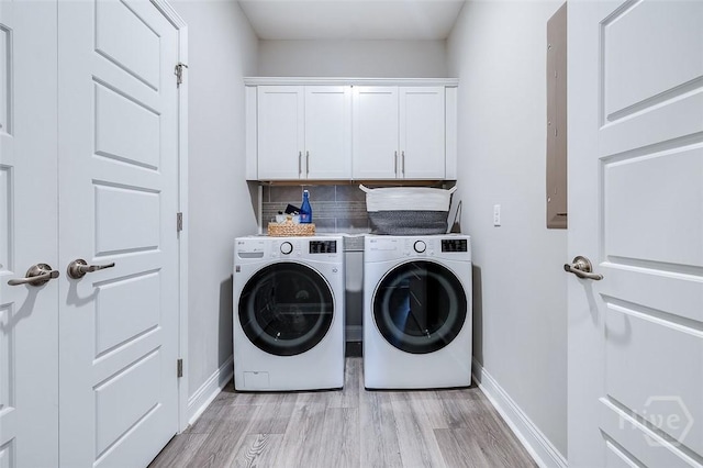 127 Champlain Dr, Pooler, GA 31322 - washroom with light wood-type flooring, cabinet space, and washing machine and dryer
