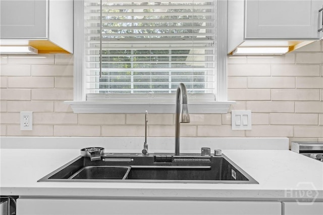 166 Old Sunbury Trl, Midway, GA 31320 - kitchen featuring decorative backsplash and light countertops