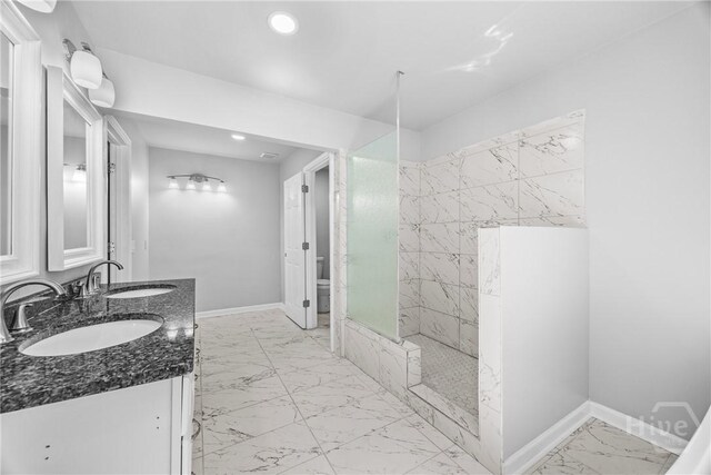 166 Old Sunbury Trl, Midway, GA 31320 - full bathroom featuring marble look tiles, double vanity, walk in shower, and recessed lighting