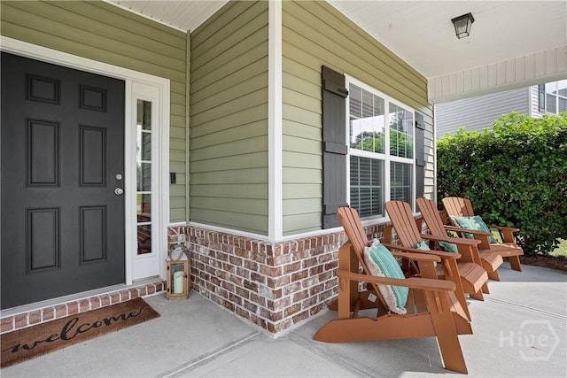 80 Sunbury Ct, Richmond Hill, GA 31324 - view of exterior entry with a porch