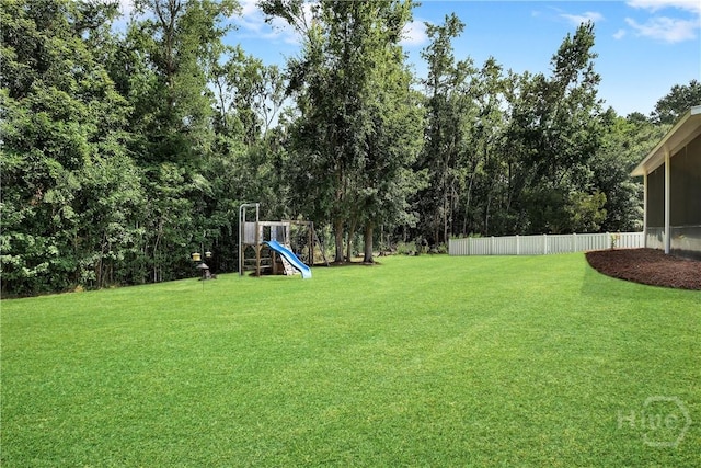 80 Sunbury Ct, Richmond Hill, GA 31324 - view of yard featuring a playground and a sunroom