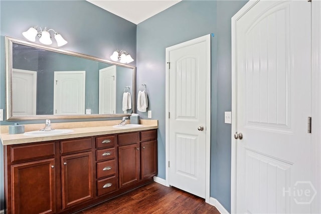80 Sunbury Ct, Richmond Hill, GA 31324 - full bath featuring double vanity and wood finished floors
