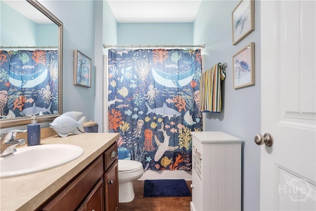 80 Sunbury Ct, Richmond Hill, GA 31324 - bathroom with vanity, wood finished floors, and curtained shower