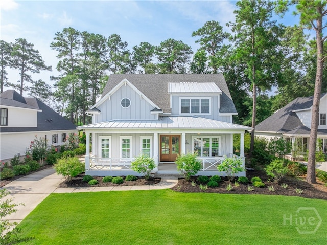 122 Kent, Pooler, GA 31322 - modern farmhouse style home featuring board and batten siding, covered porch, french doors, a front yard, and a standing seam roof