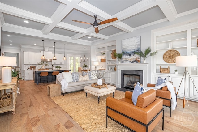 122 Kent, Pooler, GA 31322 - living room featuring a ceiling fan, a premium fireplace, beamed ceiling, crown molding, and light wood-type flooring