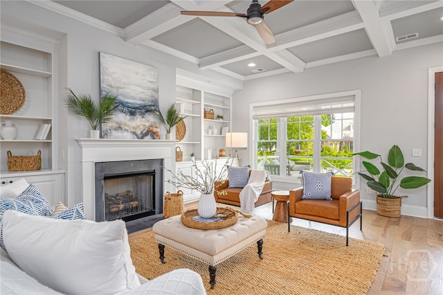 122 Kent, Pooler, GA 31322 - living area with wood finished floors, built in features, ceiling fan, a fireplace, and beamed ceiling