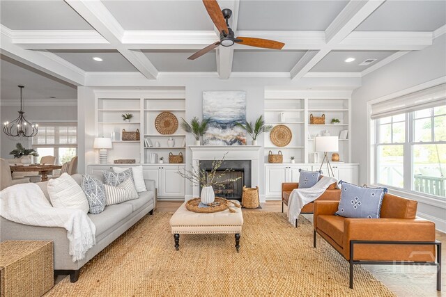 122 Kent, Pooler, GA 31322 - living area featuring coffered ceiling, crown molding, plenty of natural light, beamed ceiling, and a chandelier