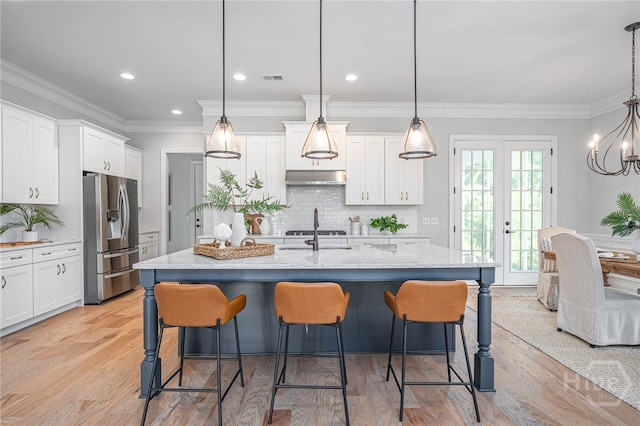122 Kent, Pooler, GA 31322 - kitchen with appliances with stainless steel finishes, under cabinet range hood, white cabinets, decorative backsplash, and crown molding