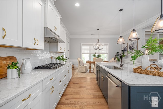 122 Kent, Pooler, GA 31322 - kitchen with stainless steel appliances, under cabinet range hood, white cabinetry, tasteful backsplash, and light wood-type flooring
