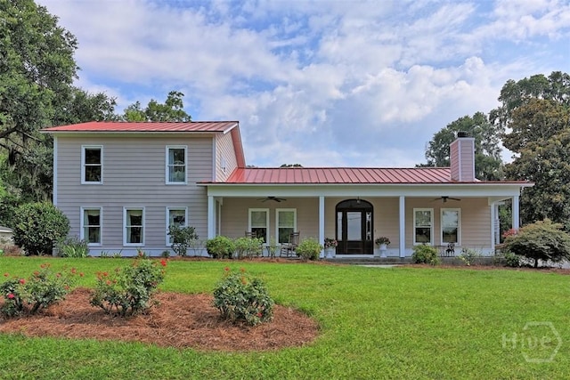 606 Rivers End Dr, Savannah, GA 31406 - back of house with ceiling fan, a chimney, a yard, and covered porch