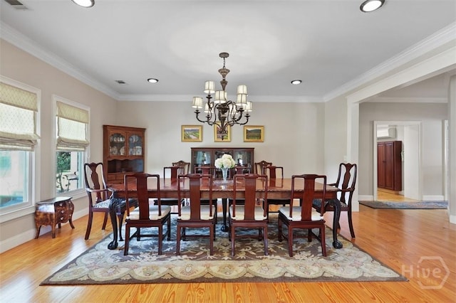 606 Rivers End Dr, Savannah, GA 31406 - dining space featuring a chandelier, recessed lighting, wood finished floors, and crown molding