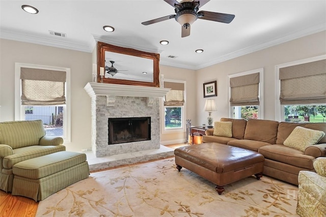 606 Rivers End Dr, Savannah, GA 31406 - living area with ceiling fan, wood finished floors, a fireplace, recessed lighting, and ornamental molding
