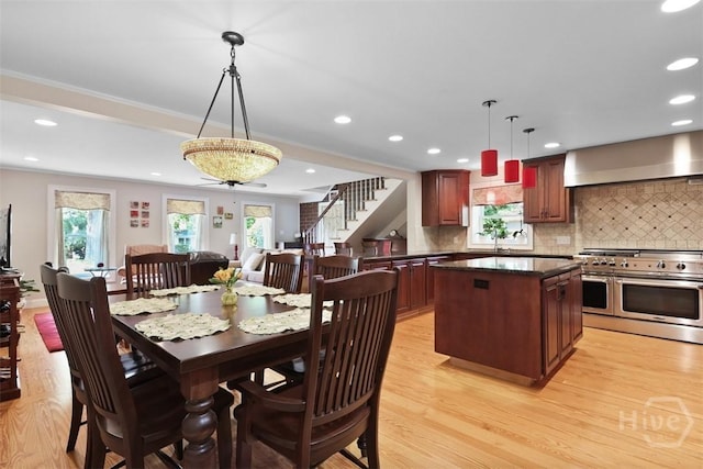 606 Rivers End Dr, Savannah, GA 31406 - dining room with plenty of natural light, stairway, light wood-style flooring, recessed lighting, and crown molding