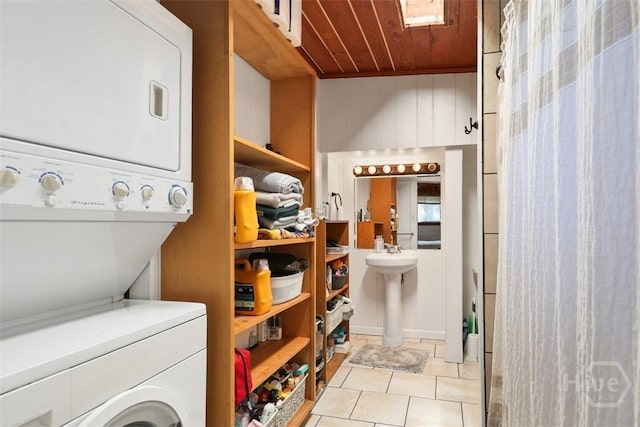 606 Rivers End Dr, Savannah, GA 31406 - laundry area with stacked washer / drying machine, wood ceiling, and light tile patterned floors