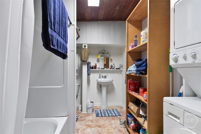 606 Rivers End Dr, Savannah, GA 31406 - laundry area with stacked washer / dryer, wooden ceiling, and stone finish floors